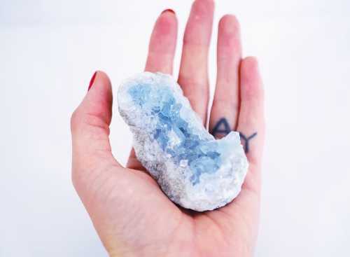 Holding blue crystal