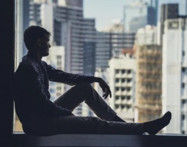 Man sitting by window