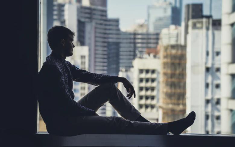 Man sitting by window